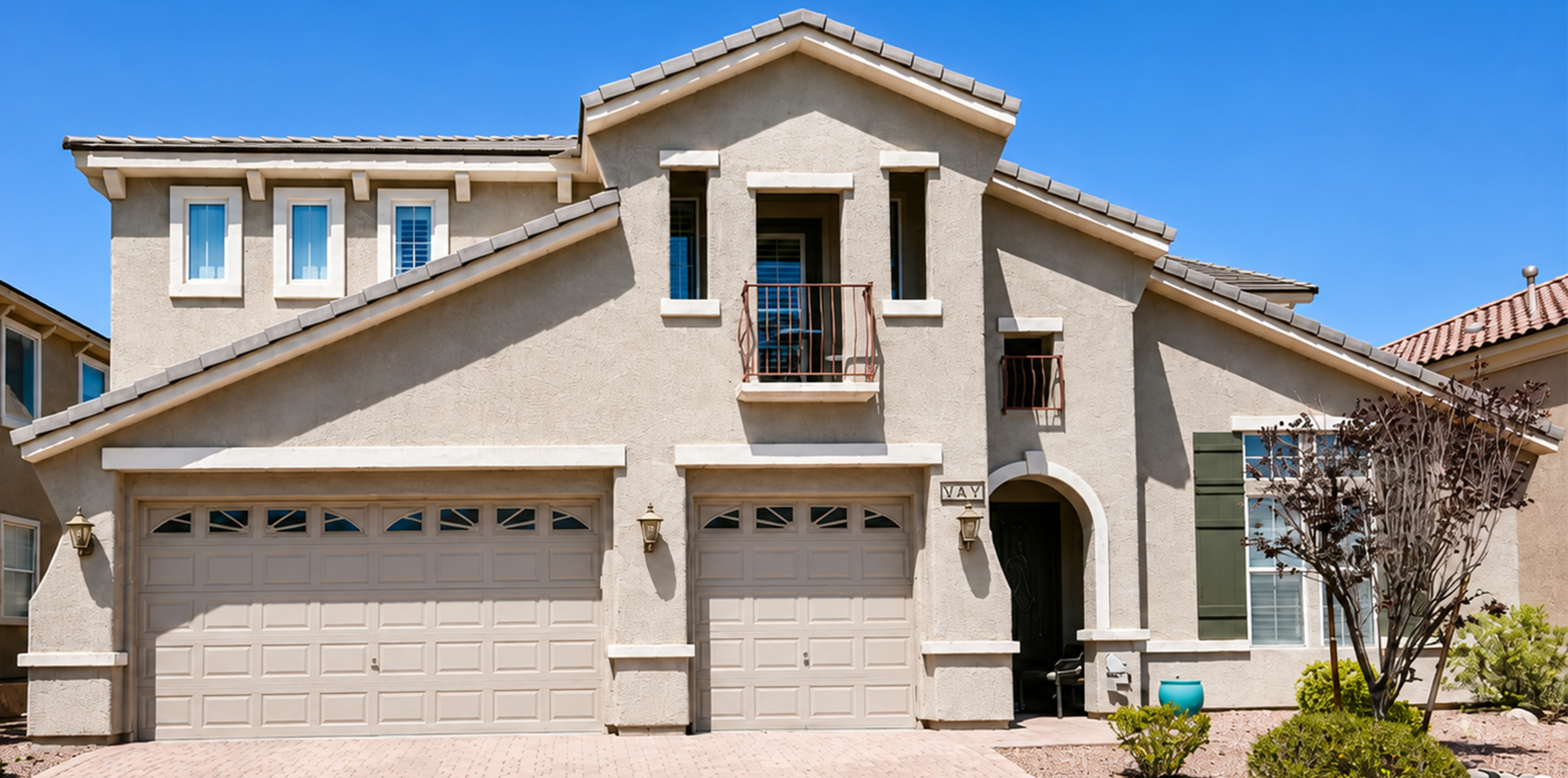 Three-car garage door configuration on a two-story home in Anthem, Henderson