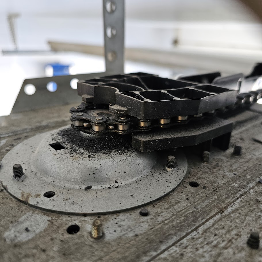 Worn garage door opener gear and sprocket assembly