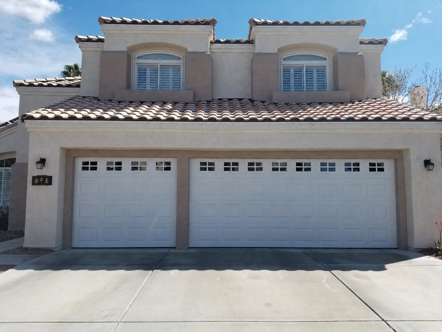 Finished white residential garage doors on a Las Vegas Valley home